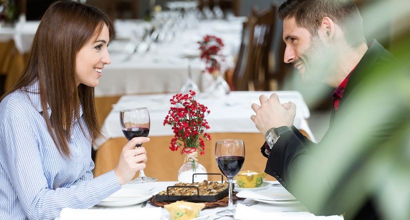 a drinking and talking couple